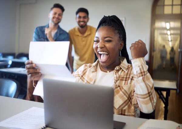 a woman celebrating the HBCU Financial Aid Process